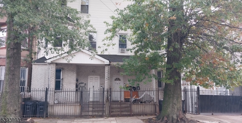 169 Mt Prospect Avenue Newark, NJ 07104 - Photo 2 of 16 a front view of a house with tree s