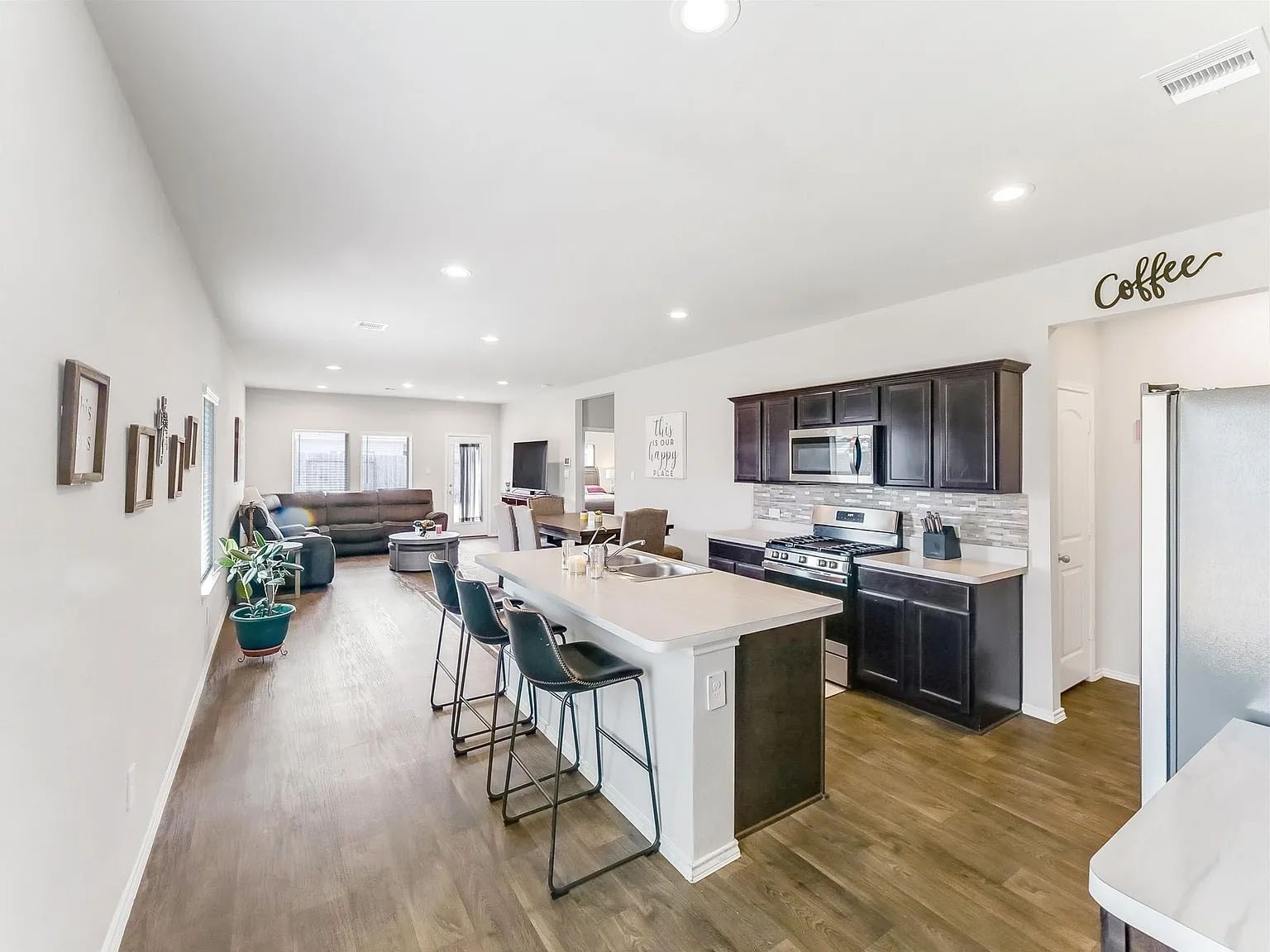 2406 High Spruce Circle Spring, TX 77373 - Photo 11 of 32 a large kitchen with a table and chairs