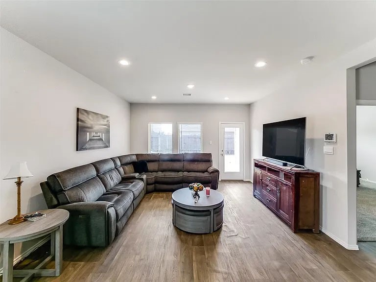 2406 High Spruce Circle Spring, TX 77373 - Photo 14 of 32 a living room with furniture and a flat screen tv