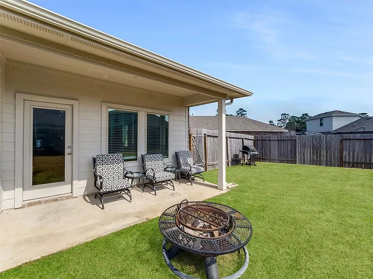 2406 High Spruce Circle Spring, TX 77373 - Photo 29 of 32 a swimming pool with outdoor seating and yard