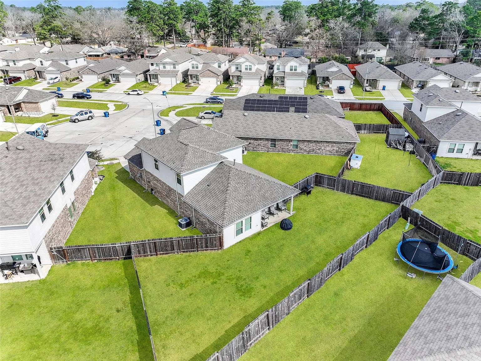 2406 High Spruce Circle Spring, TX 77373 - Photo 31 of 32 an aerial view of a house with a swimming pool