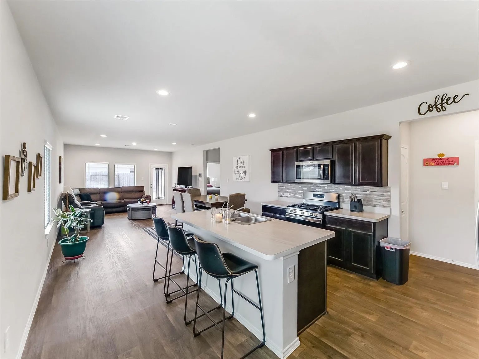 2406 High Spruce Circle Spring, TX 77373 - Photo 6 of 32 a view of kitchen with cabinets stainless steel appliances with wooden floor