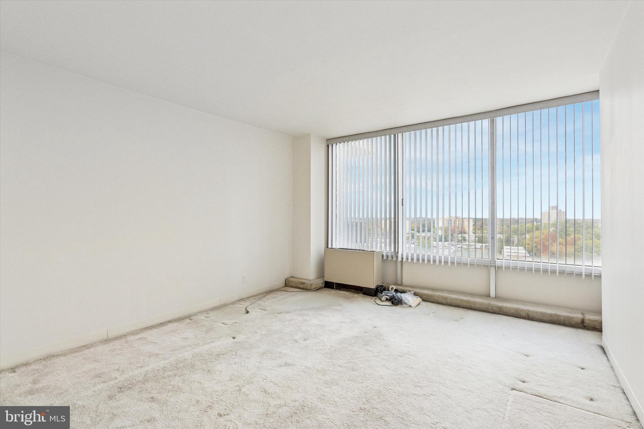 3900 West Ford Road, Unit 15C Philadelphia, PA 19131 - Photo 12 of 15 an empty room with floor to ceiling window