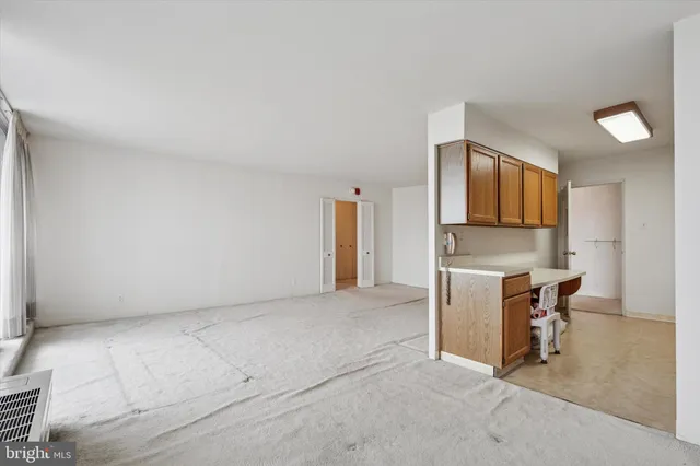 a view of kitchen with furniture and window