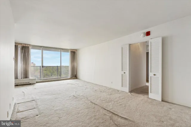 a view of an empty room with a window