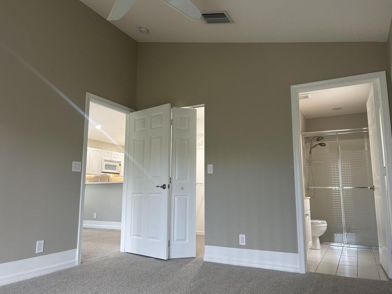 1107 Via Jardin Riviera Beach, FL 33418 - Photo 8 of 21 a bathroom with a shower and a toilet