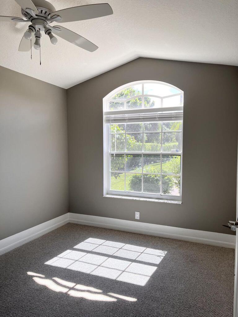 1107 Via Jardin Riviera Beach, FL 33418 - Photo 9 of 21 an empty room with a window