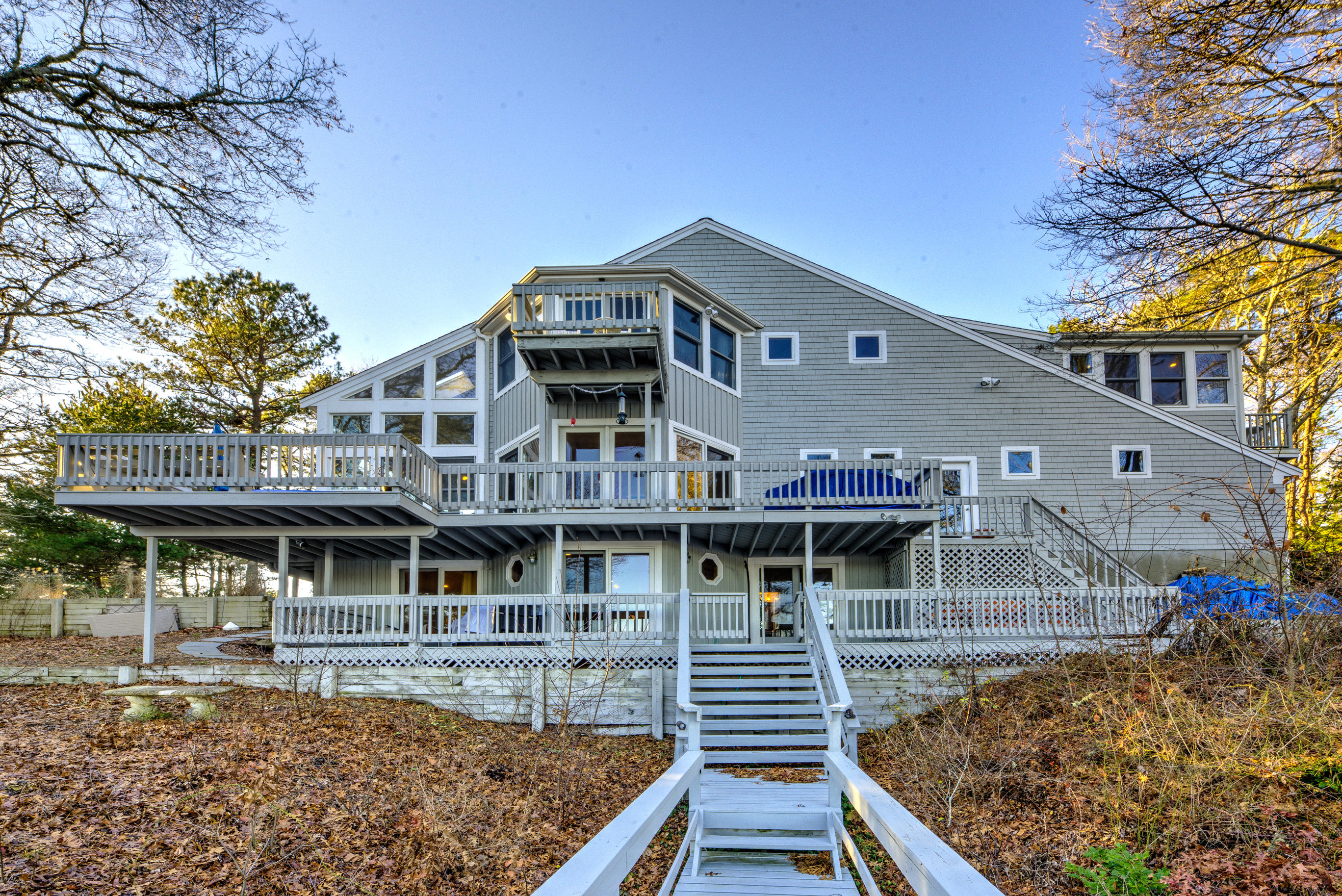 58 Quaker Run Road Mashpee, MA 02649 - Photo 29 of 34 a view of a large building with a big yard and large trees
