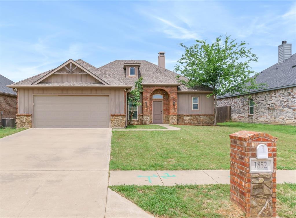 1852 Meadowview Canton, TX 75103 - Photo 1 of 28 a front view of a house with garden