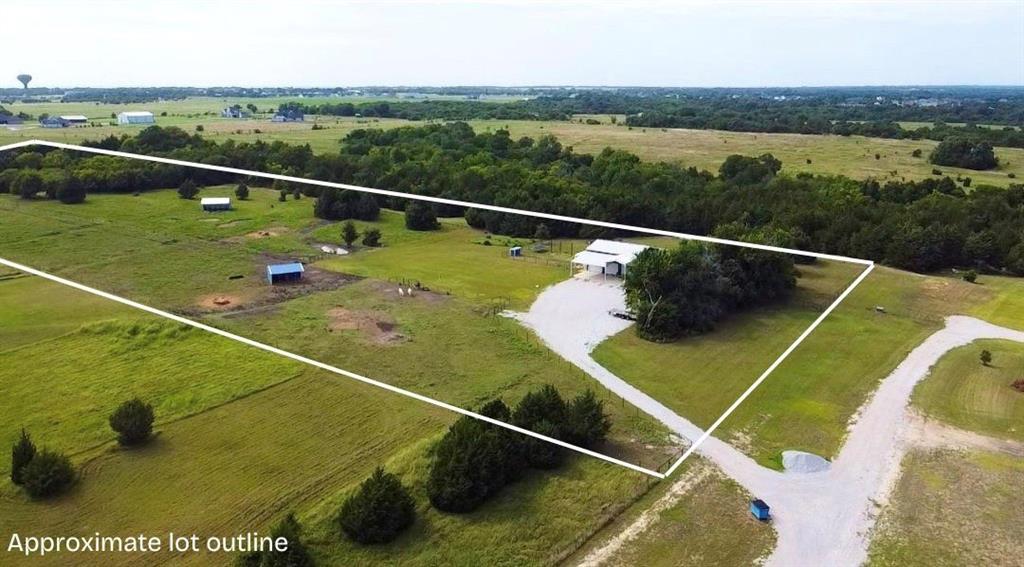 Aerial view of sparsely populated area with property boundaries highlighted