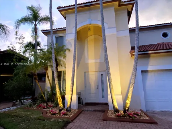 a front view of a house with a yard