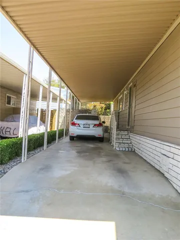 a view of car parked in front of house