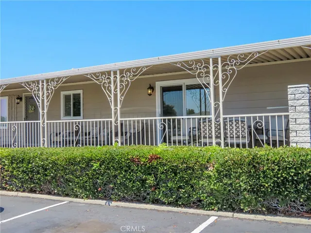 a view of a house with a flower garden