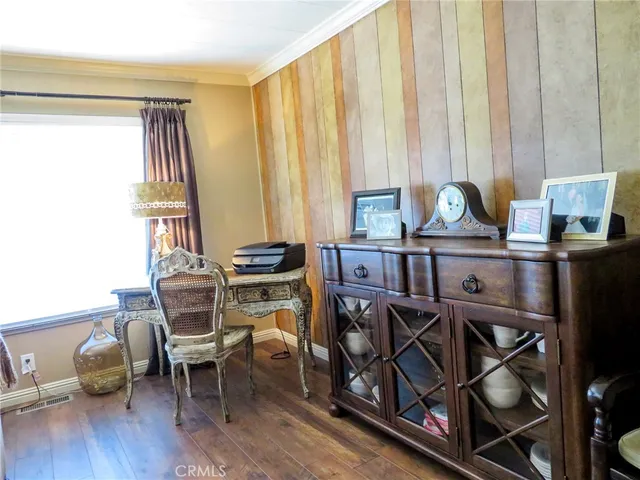 a view of a dining room with furniture and window