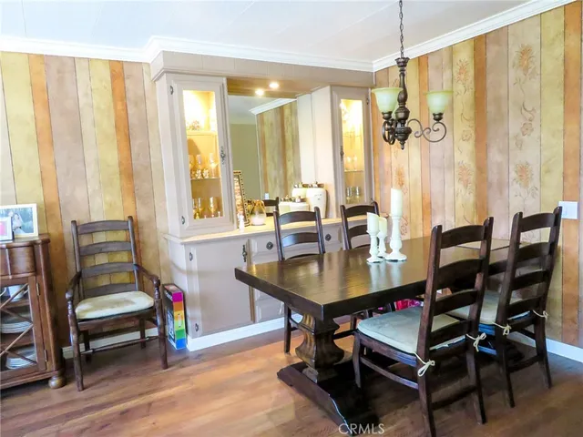 a view of a dining room with furniture and window