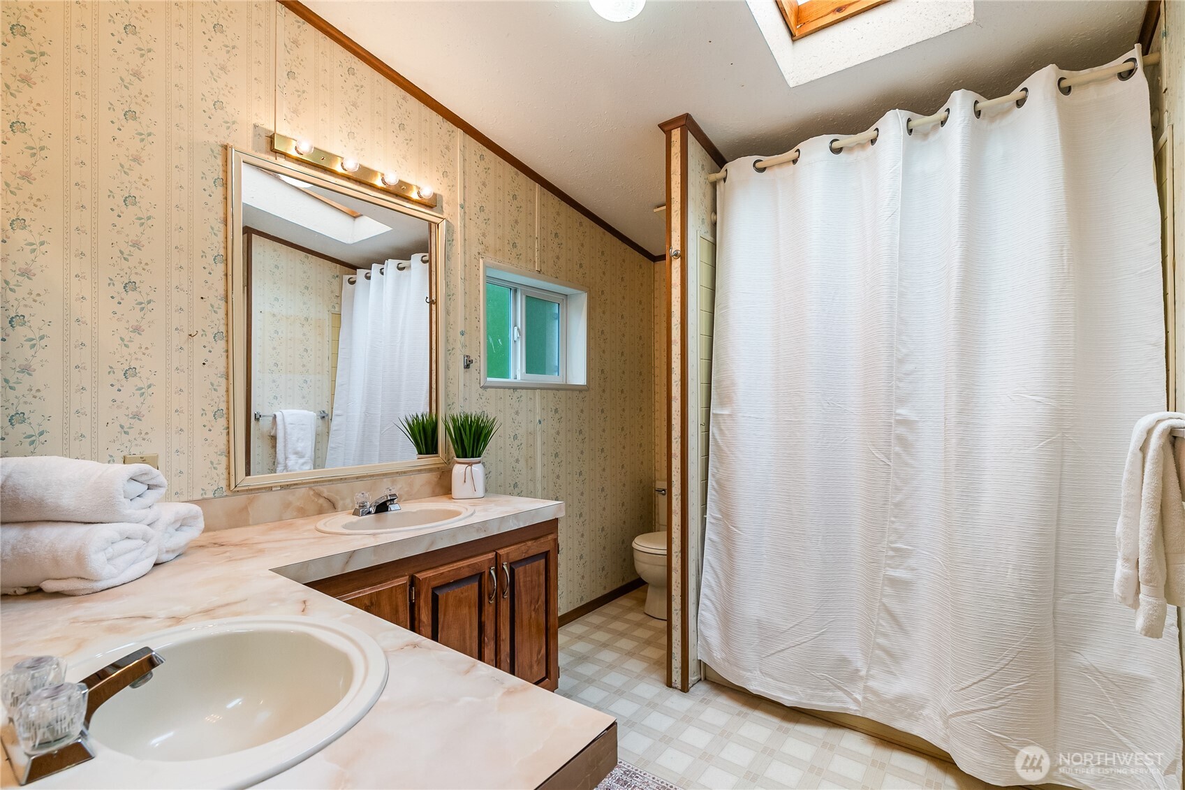 3191 Creasey Road Custer, WA 98240 - Photo 15 of 36 a bathroom with a sink and a mirror
