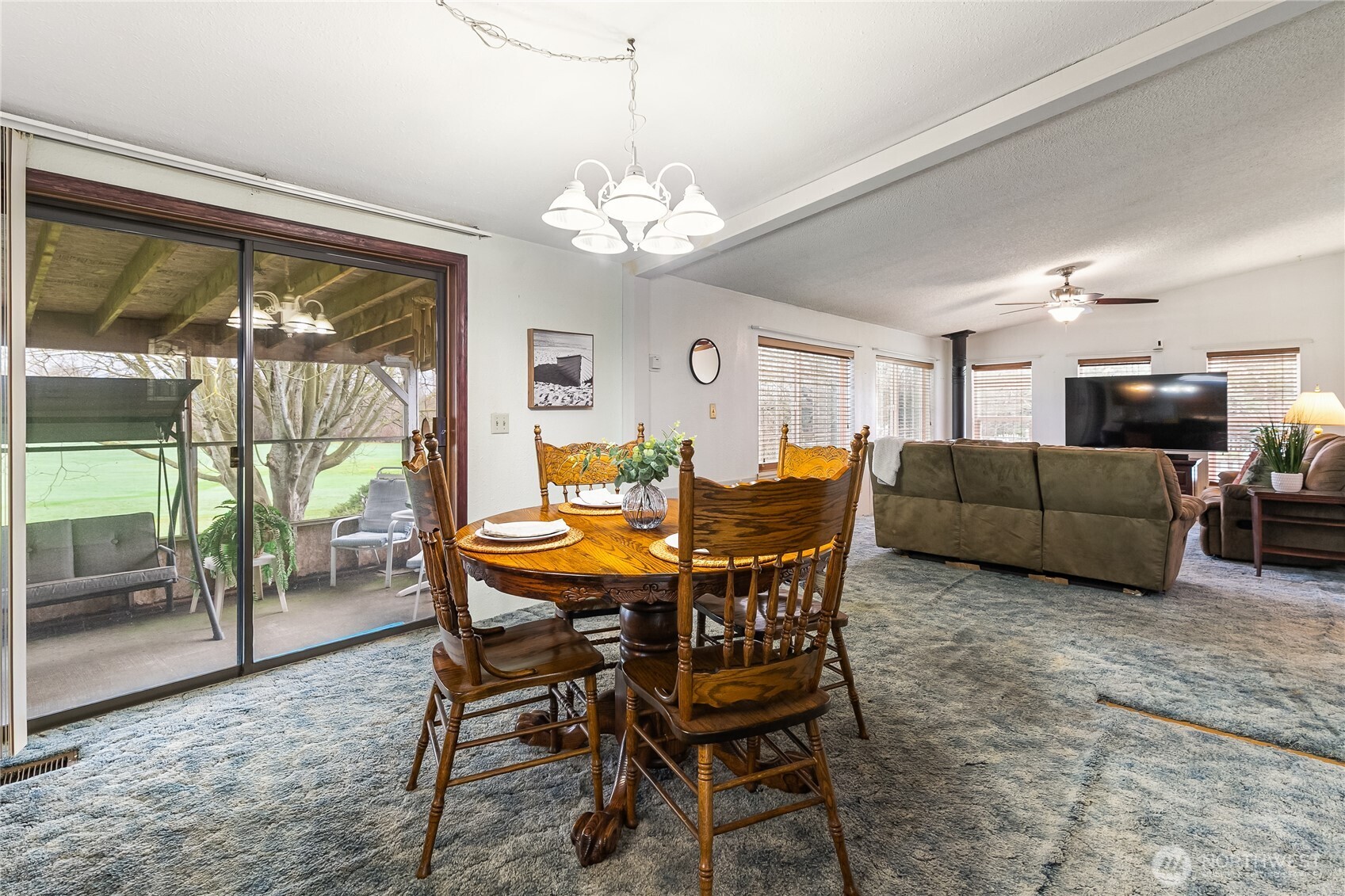 3191 Creasey Road Custer, WA 98240 - Photo 20 of 36 a view of a dining room with furniture large windows and wooden floor