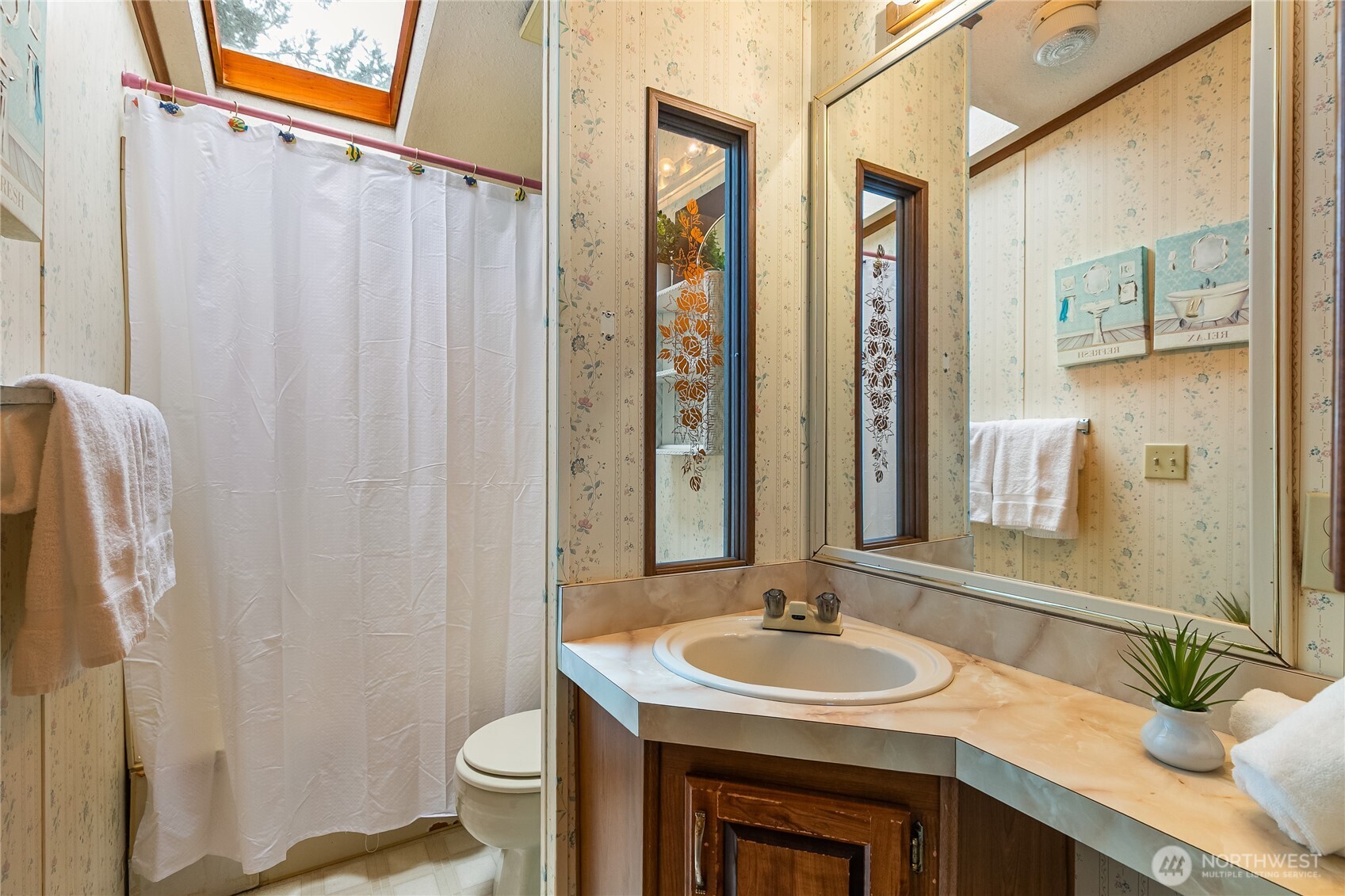 3191 Creasey Road Custer, WA 98240 - Photo 28 of 36 a bathroom with a granite countertop sink and a mirror
