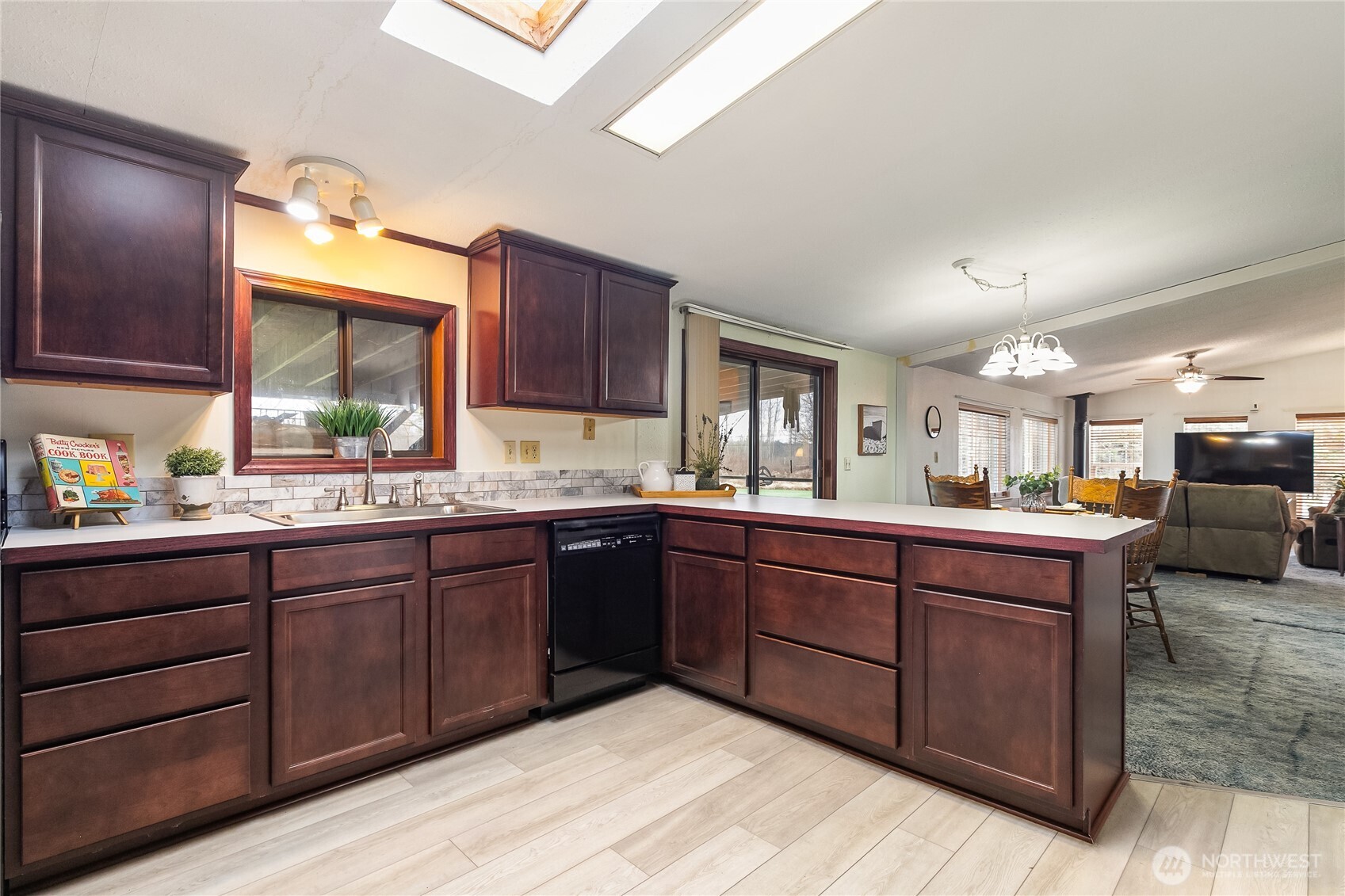 3191 Creasey Road Custer, WA 98240 - Photo 8 of 36 a kitchen with stainless steel appliances granite countertop wooden cabinets a sink and dishwasher with wooden floor