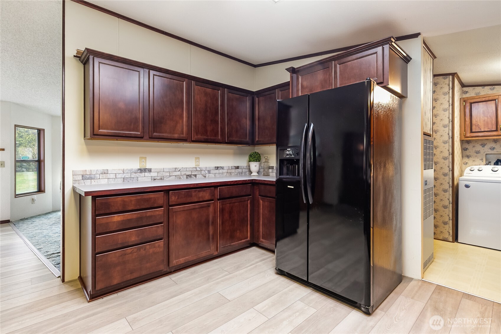 3191 Creasey Road Custer, WA 98240 - Photo 9 of 36 a kitchen with granite countertop wooden cabinets and stainless steel appliances