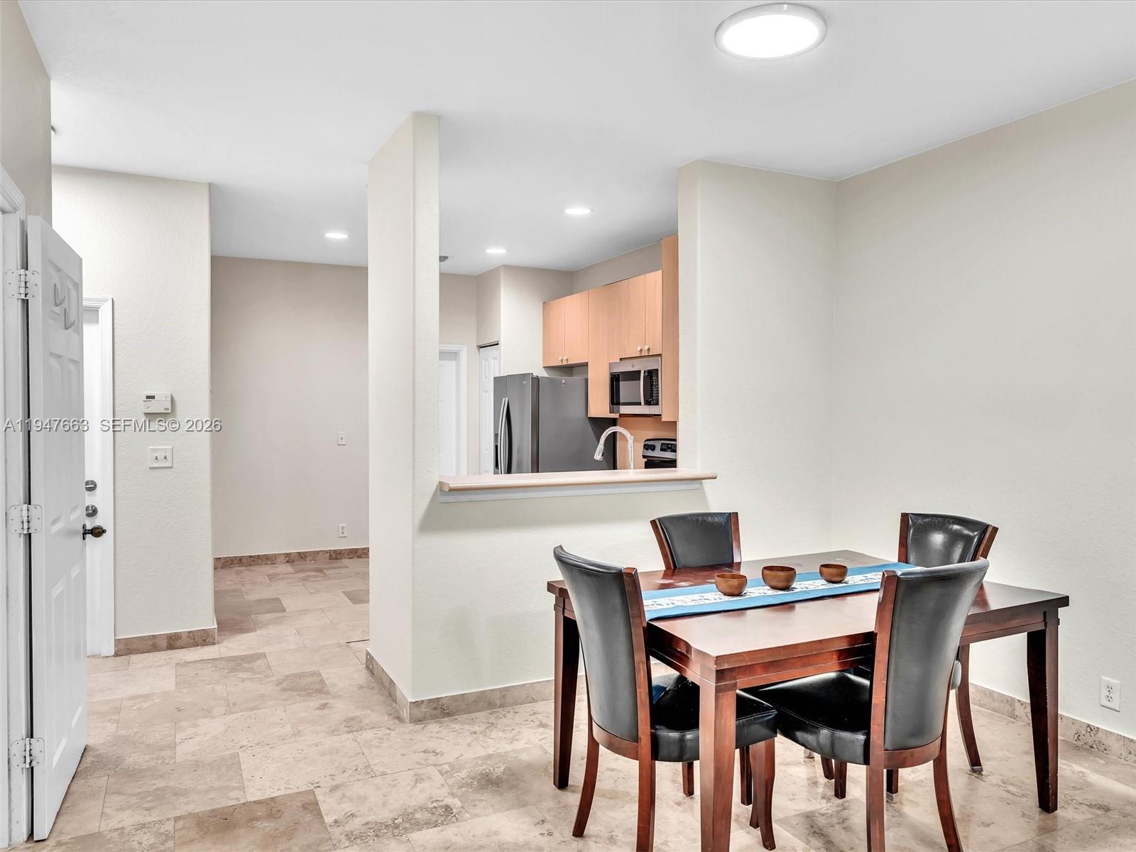 3853 Tree Top Drive, Unit 3853 Weston, FL 33332 - Photo 11 of 43 a view of a dining room with furniture