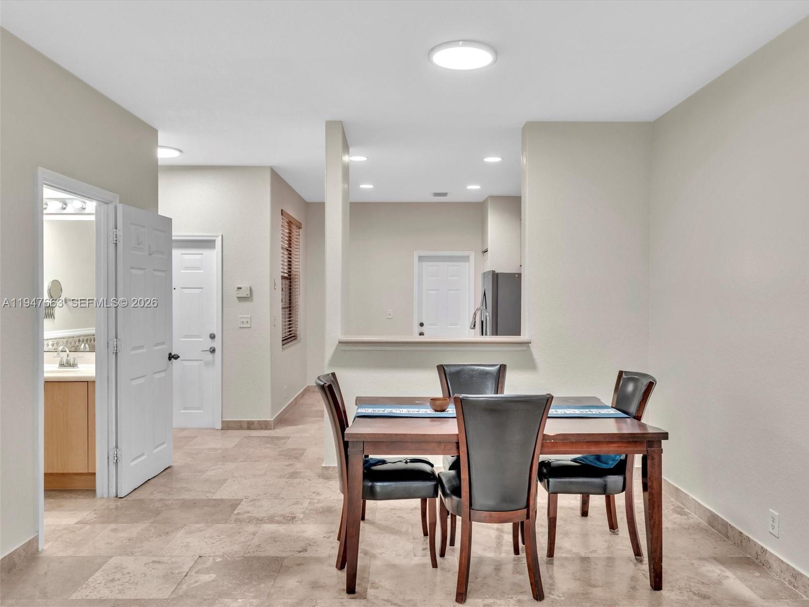 3853 Tree Top Drive, Unit 3853 Weston, FL 33332 - Photo 12 of 43 a view of a dining room with furniture