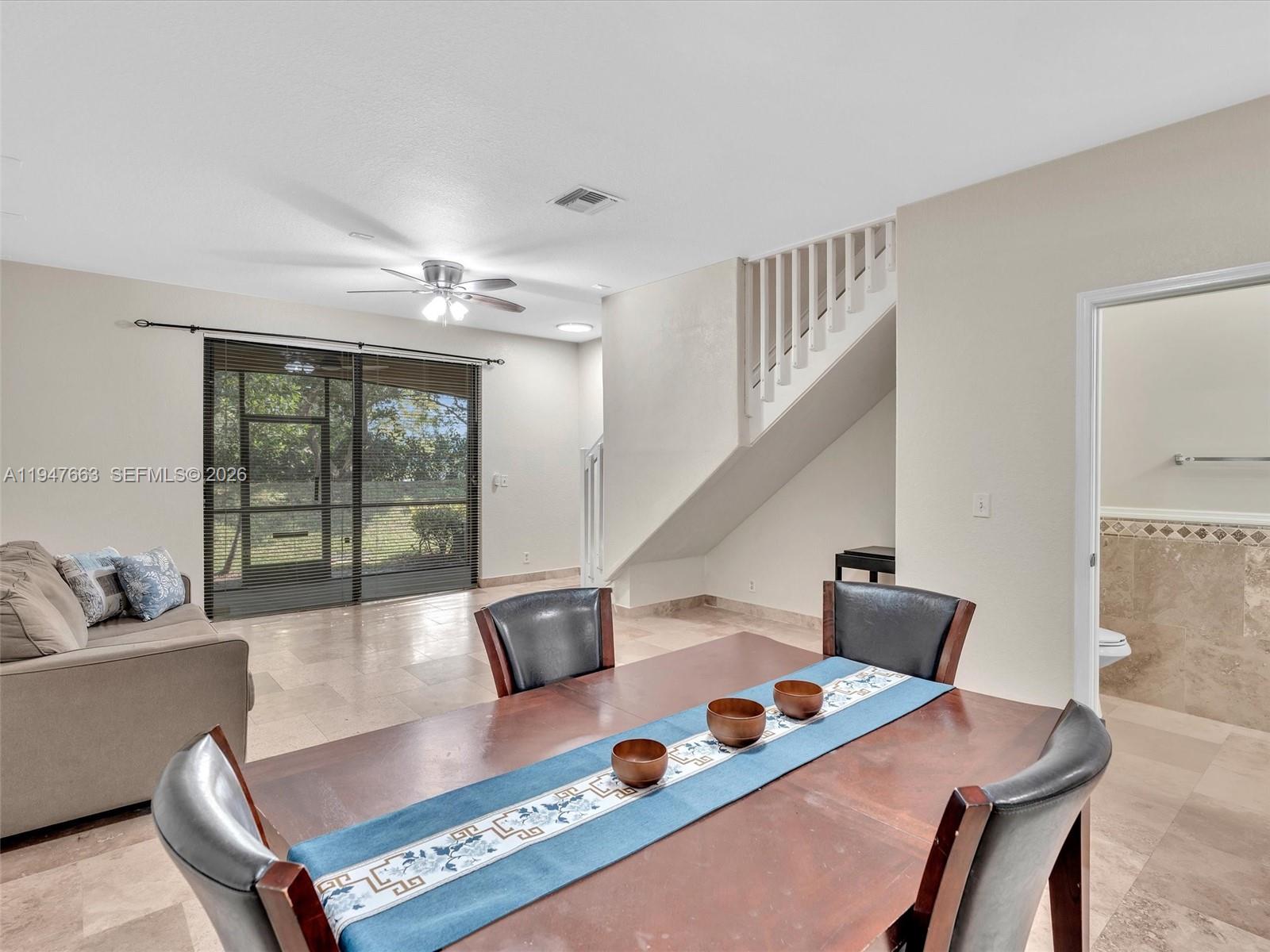 3853 Tree Top Drive, Unit 3853 Weston, FL 33332 - Photo 13 of 43 a living room with furniture and a large window