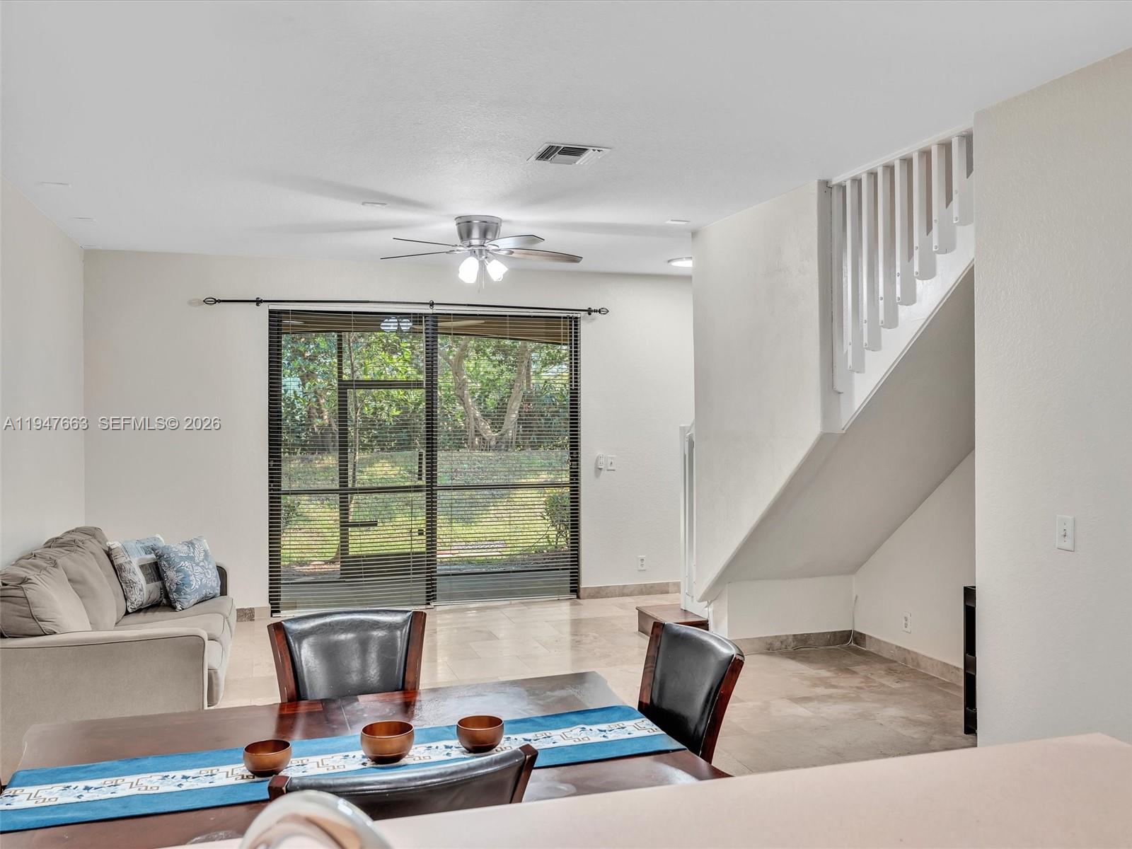 3853 Tree Top Drive, Unit 3853 Weston, FL 33332 - Photo 14 of 43 a living room with furniture and a large window