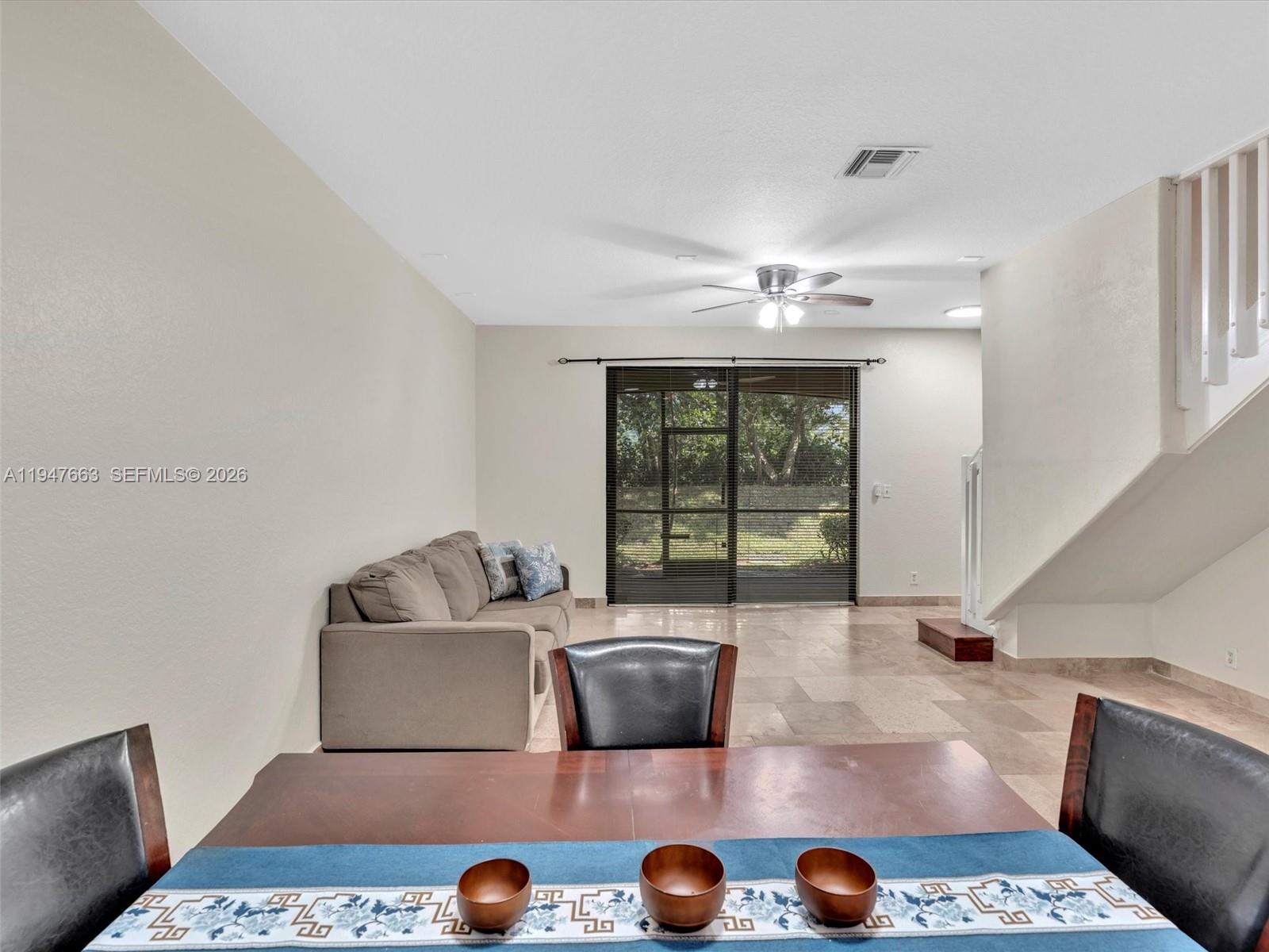 3853 Tree Top Drive, Unit 3853 Weston, FL 33332 - Photo 16 of 43 a living room with furniture and a rug