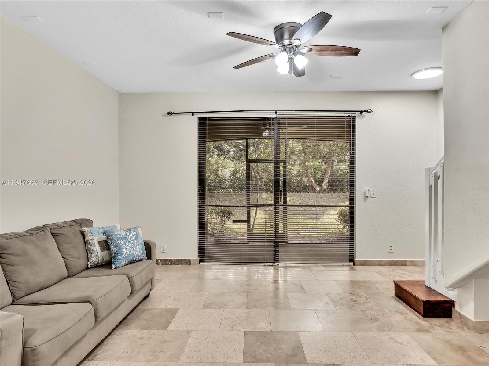 3853 Tree Top Drive, Unit 3853 Weston, FL 33332 - Photo 17 of 43 a living room with furniture and a ceiling fan