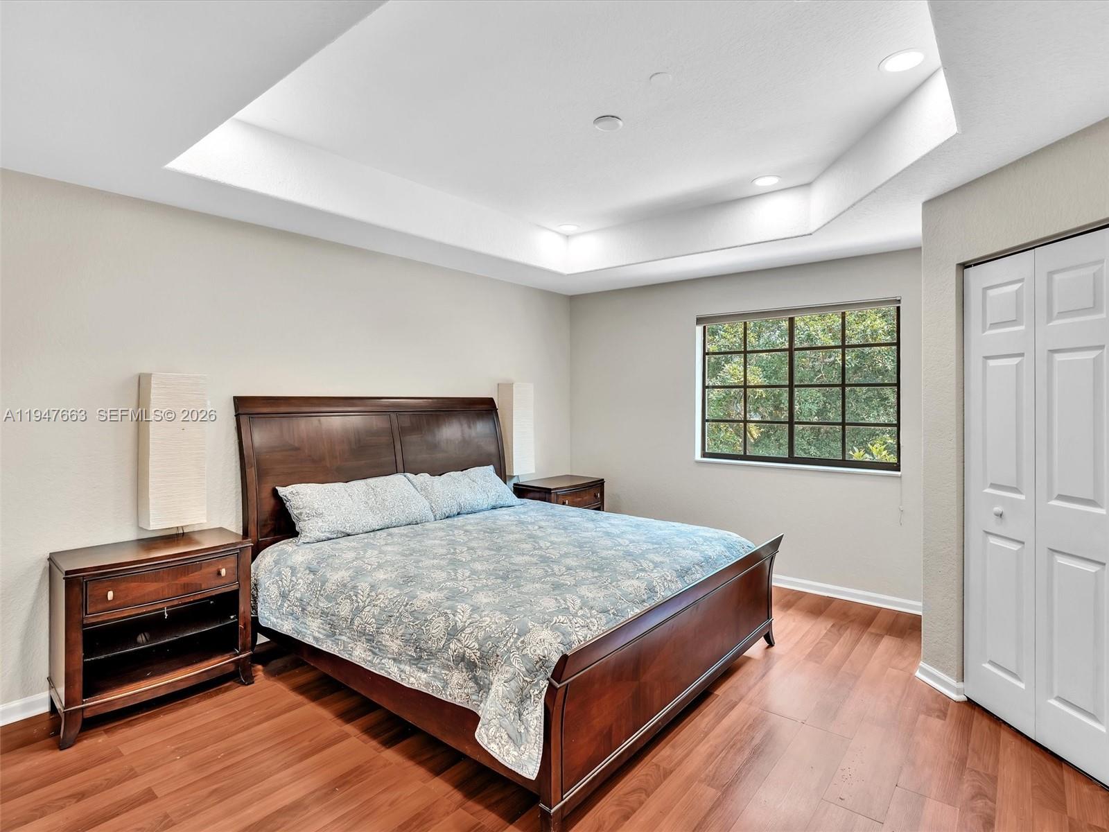 3853 Tree Top Drive, Unit 3853 Weston, FL 33332 - Photo 24 of 43 a bedroom with a bed and window