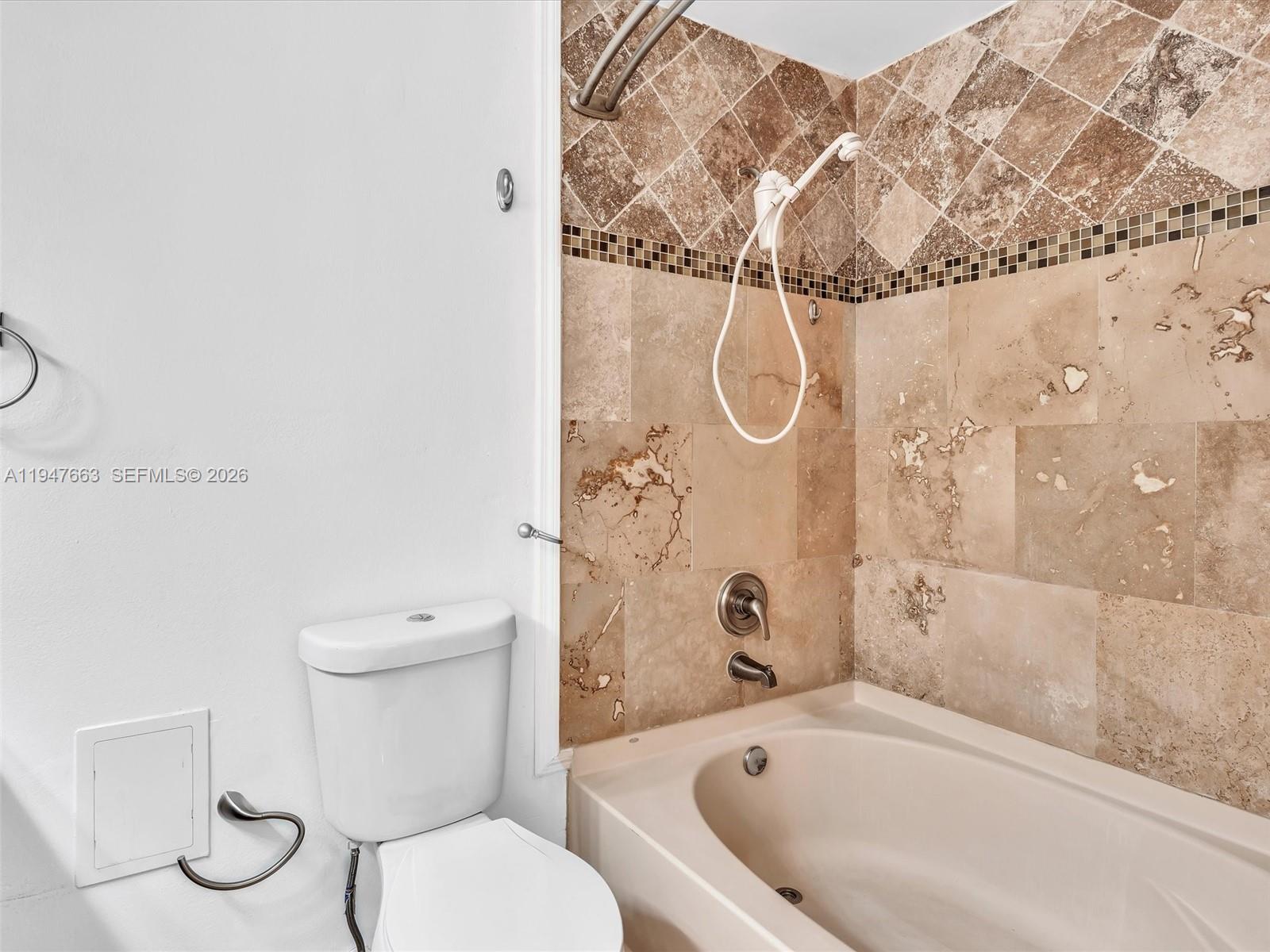 3853 Tree Top Drive, Unit 3853 Weston, FL 33332 - Photo 28 of 43 a bathroom with a toilet and a bathtub