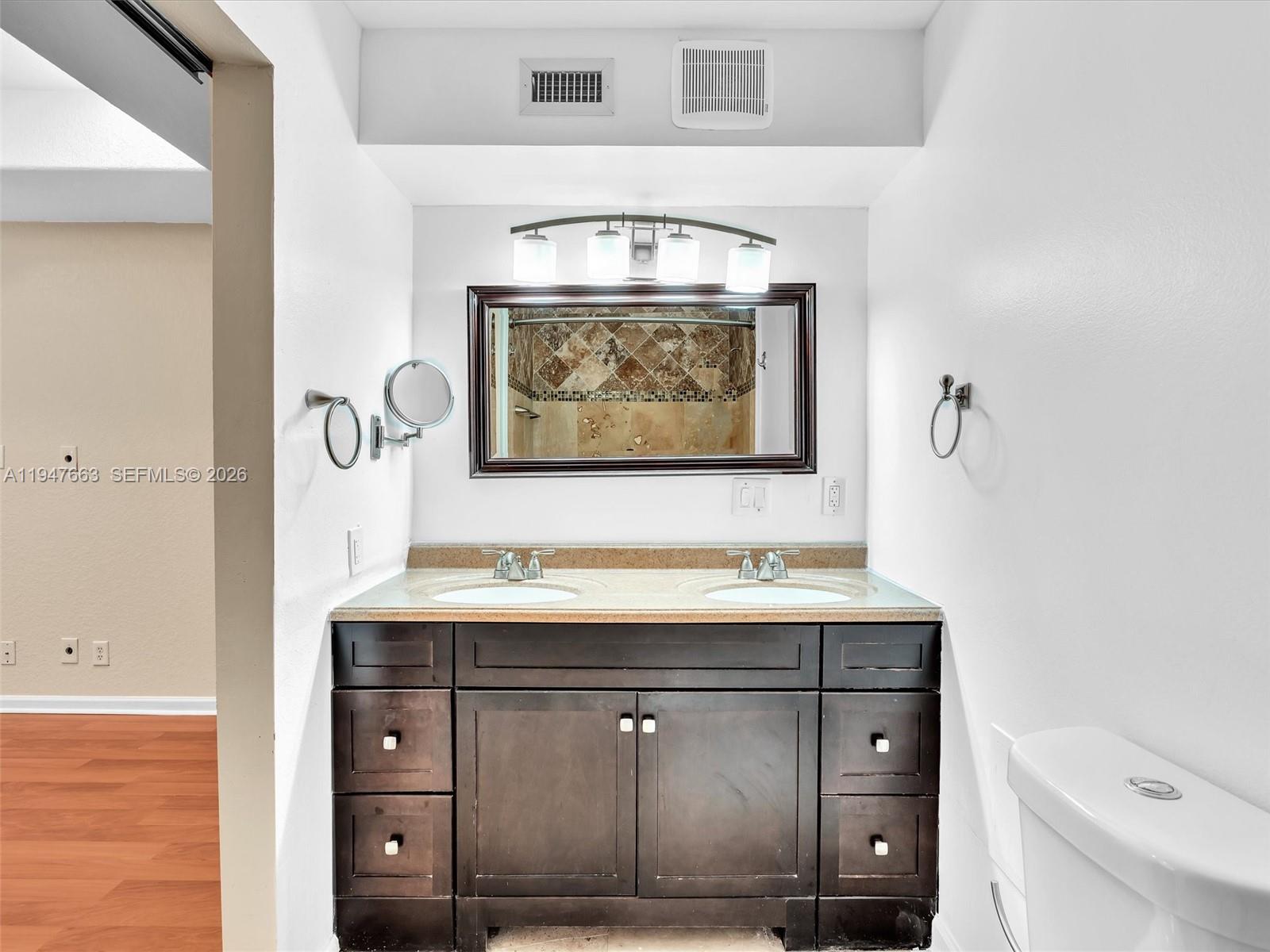 3853 Tree Top Drive, Unit 3853 Weston, FL 33332 - Photo 29 of 43 a bathroom with a sink and a toilet