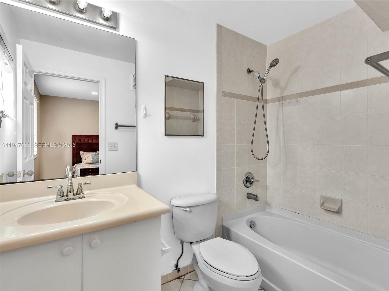 3853 Tree Top Drive, Unit 3853 Weston, FL 33332 - Photo 33 of 43 a bathroom with a sink toilet vanity and shower