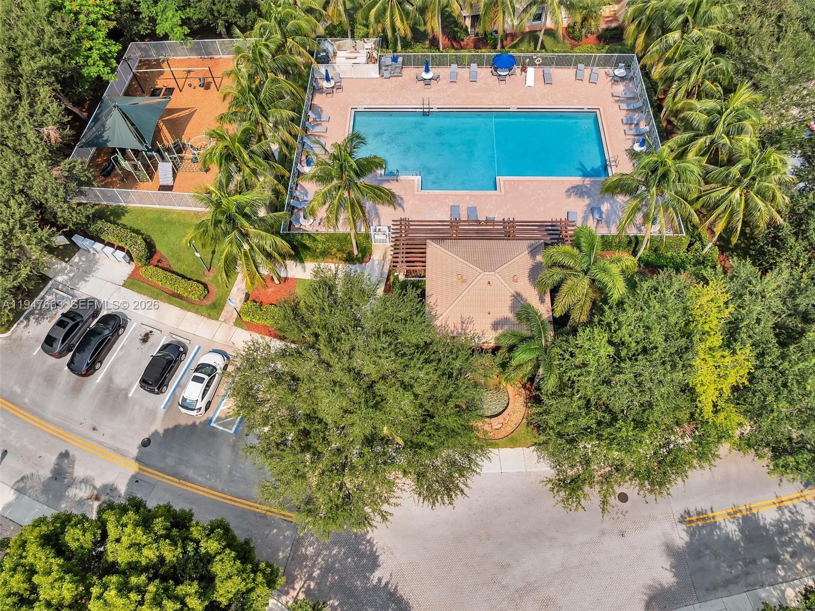 3853 Tree Top Drive, Unit 3853 Weston, FL 33332 - Photo 37 of 43 an aerial view of a house with a yard and garden