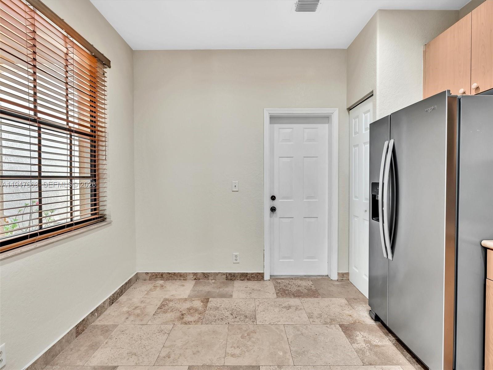 3853 Tree Top Drive, Unit 3853 Weston, FL 33332 - Photo 7 of 43 a view of an empty room with a kitchen