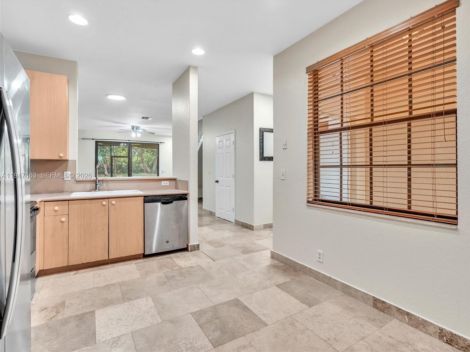 3853 Tree Top Drive, Unit 3853 Weston, FL 33332 - Photo 8 of 43 a large kitchen with a large window