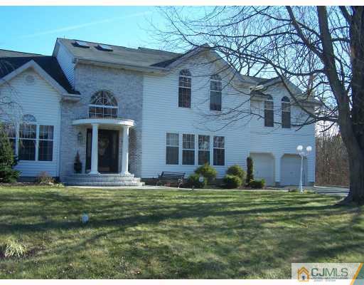 115 Westley Road Old Bridge, NJ 08857 - Photo 1 of 10 a front view of a house with a yard