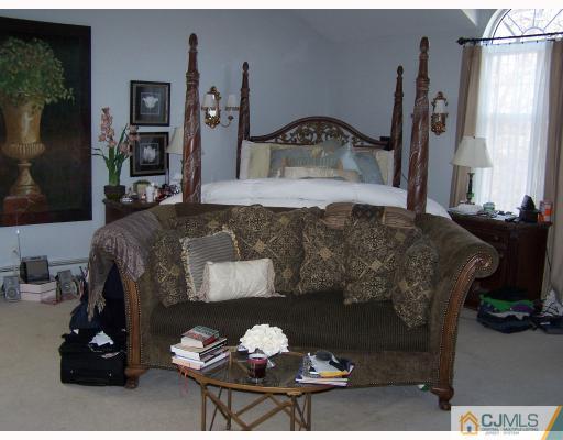 115 Westley Road Old Bridge, NJ 08857 - Photo 6 of 10 a living room with furniture and a fireplace