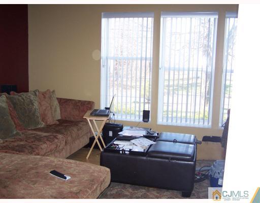 115 Westley Road Old Bridge, NJ 08857 - Photo 9 of 10 a living room with furniture and a window