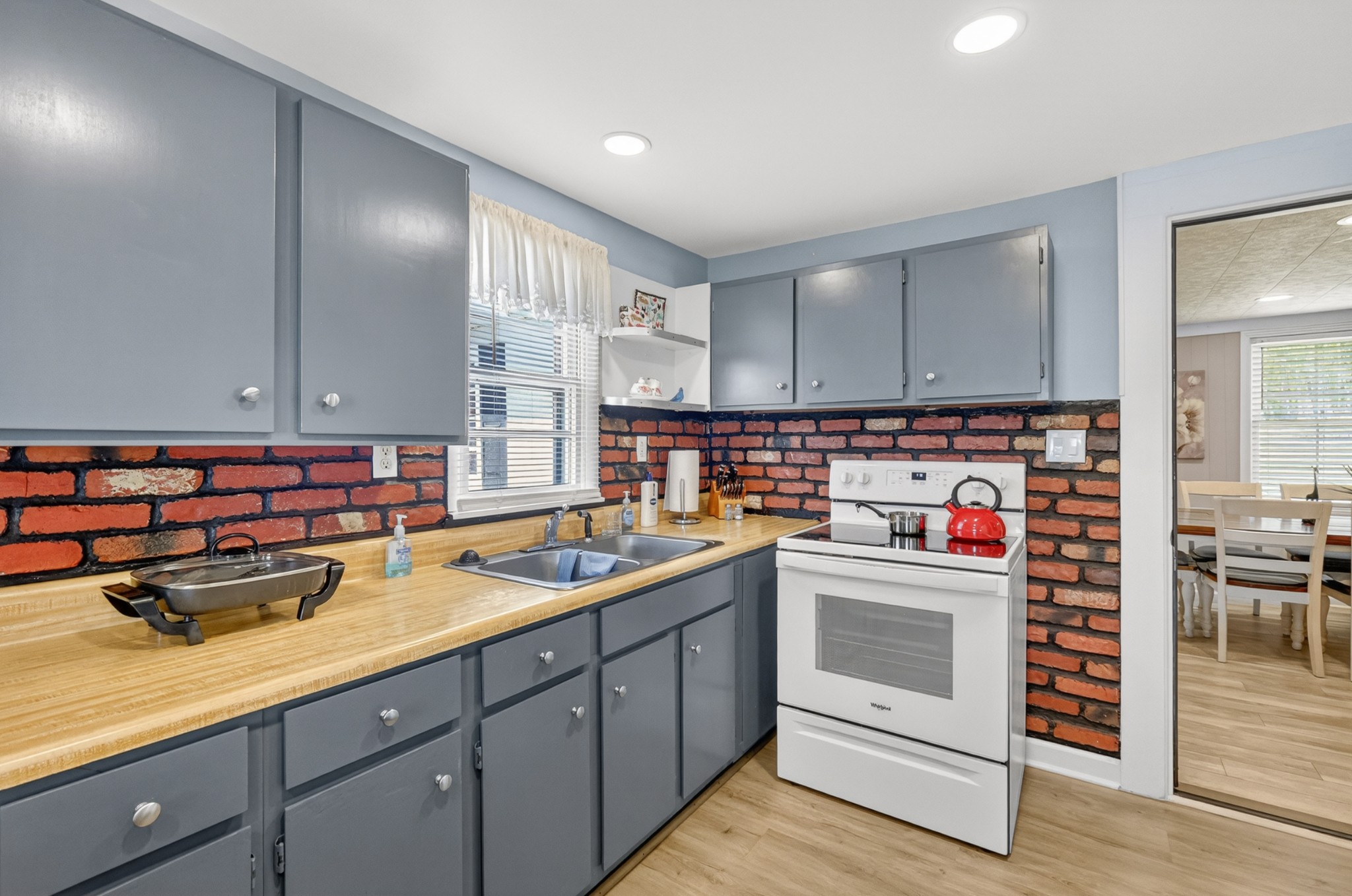 233 Rucker Road Murfreesboro, TN 37127 - Photo 13 of 43 a kitchen with a sink and cabinets