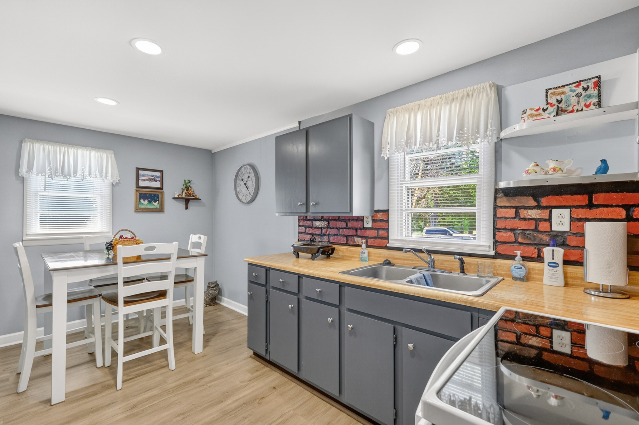 233 Rucker Road Murfreesboro, TN 37127 - Photo 14 of 43 a kitchen with a sink stove and cabinets