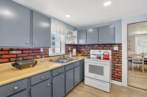 a kitchen with a sink and cabinets