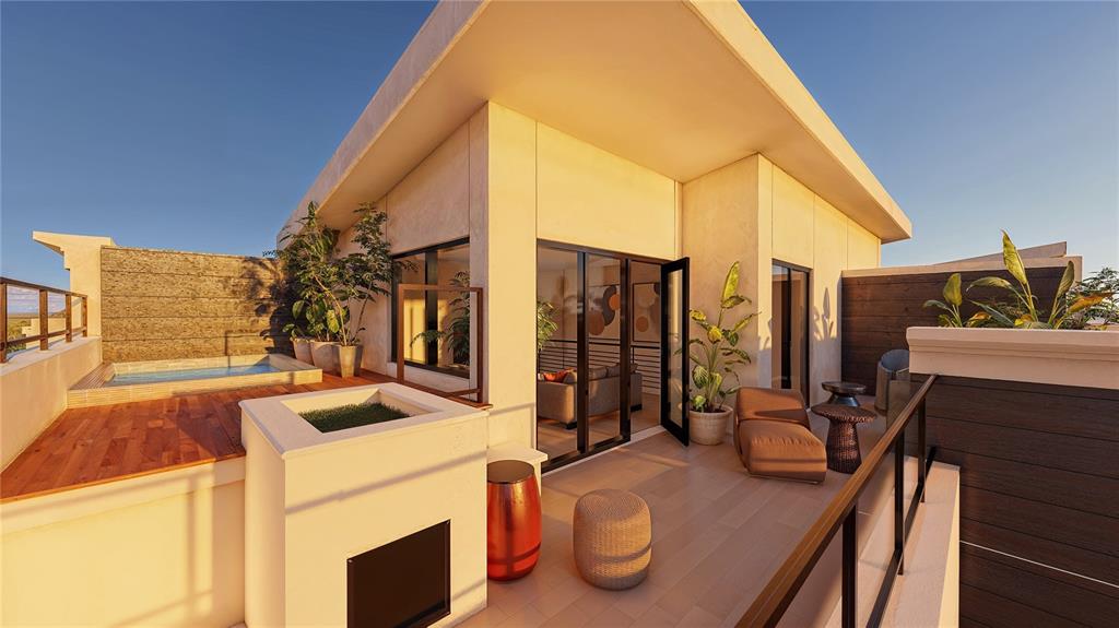 a view of outdoor kitchen with seating area