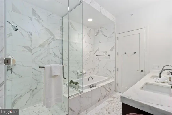 a bathroom with a bathtub and a sink