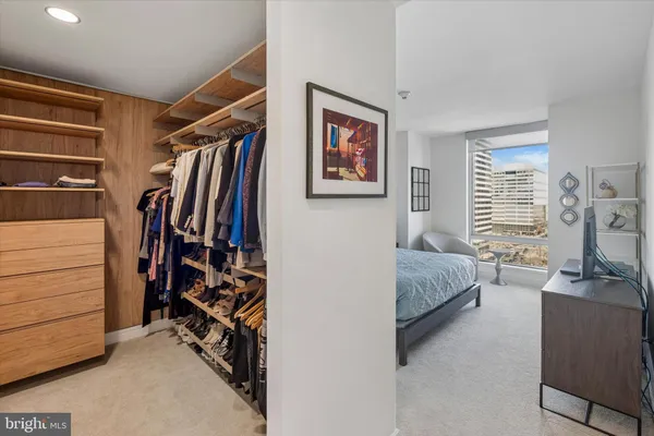 a bedroom with a bed and a walk in closet