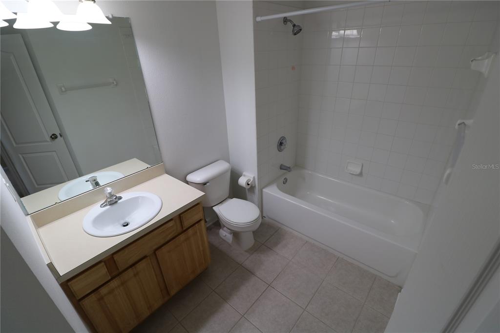 4866 Pond Ridge Drive Riverview, FL 33578 - Photo 31 of 38 a bathroom with a sink toilet and shower
