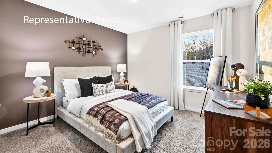 1026 Horizon Lane Chester, SC 29706 - Photo 24 of 28 a bedroom with bed and a potted plant