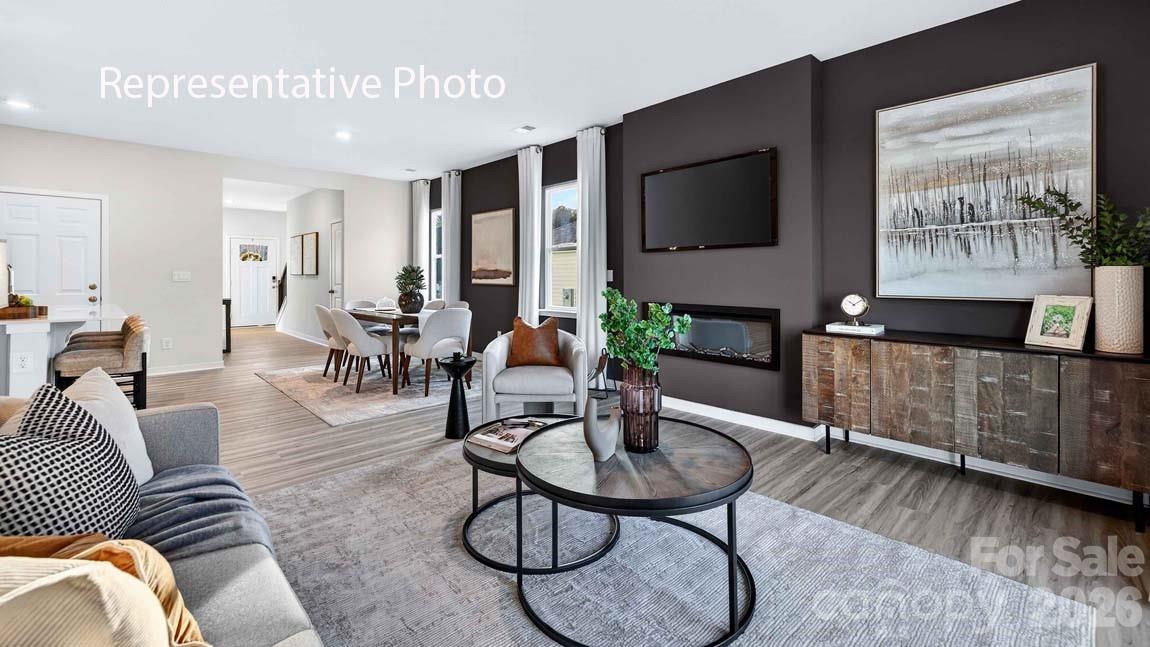 1026 Horizon Lane Chester, SC 29706 - Photo 9 of 28 a living room with furniture a flat screen tv and kitchen view