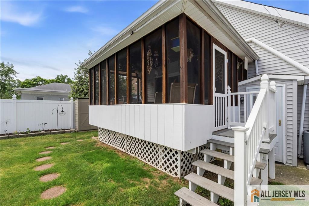 50 3rd Street Fords, NJ 08863 - Photo 31 of 36 a view of wooden house with a small yard